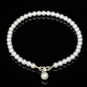Luminescence: 10mm White Pearl & CZ Bow Pendant Set w/Shimmering Pearl Ear Stud
